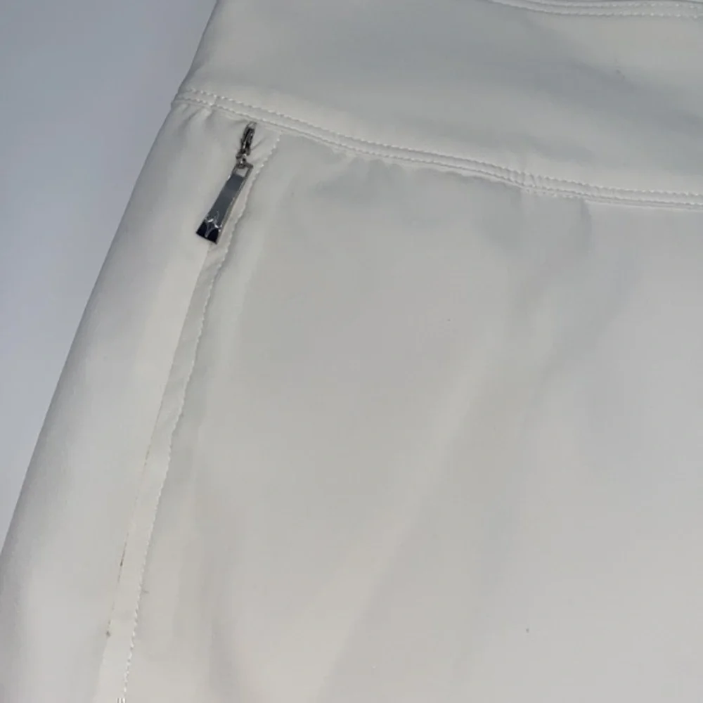 UEC Jofit essential golf skort white size “2” equivalent small tag cut out